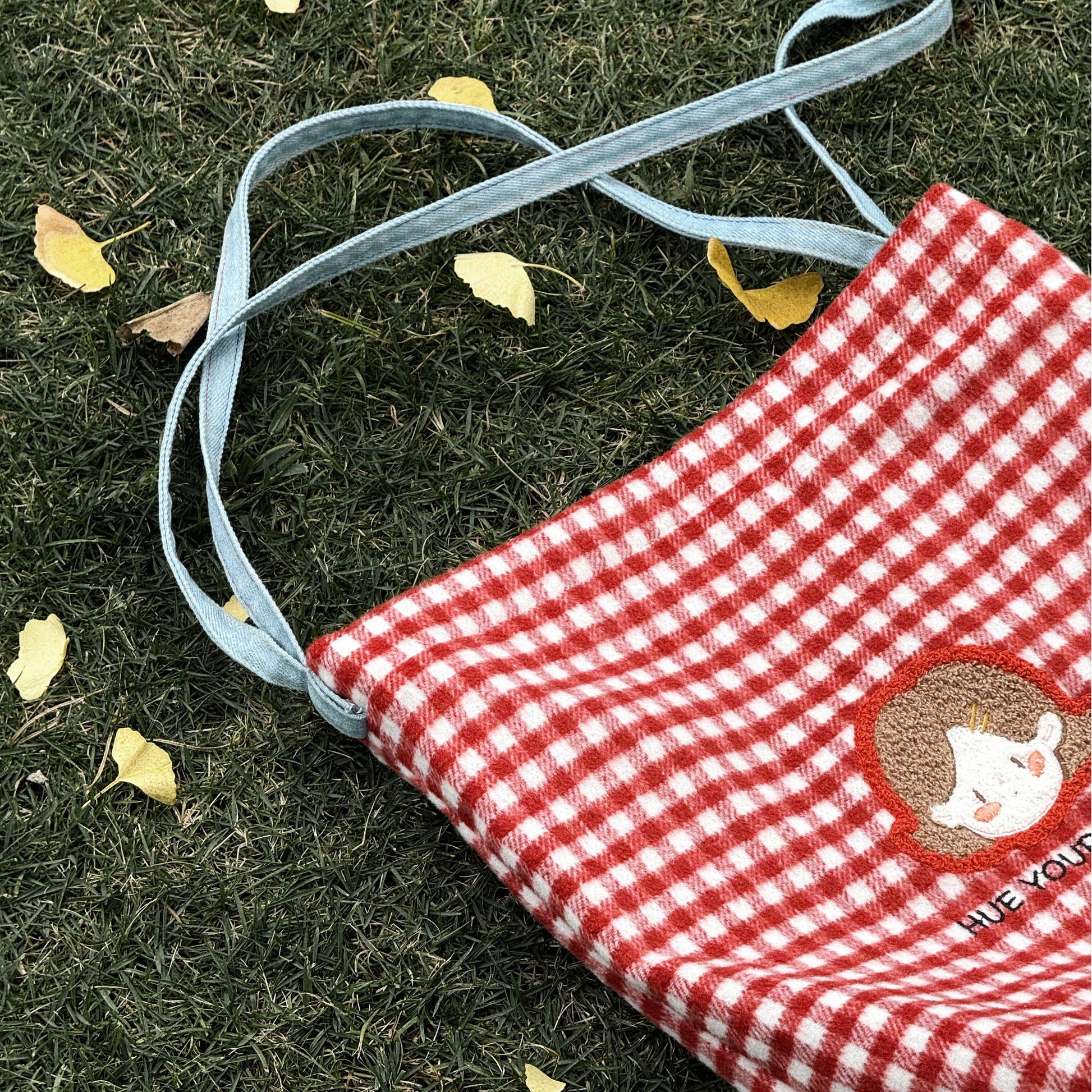 this designer canvas bag captures the essence of individuality, creativity, and positivity. Crafted from durable, eco-friendly canvas, it’s as practical as it is stylish, perfect for carrying your essentials while staying true to your colorful, confident personality. Step out with the Little Hue Red and White Square "HUE YOUR MOD" bag and let your style speak volumes.